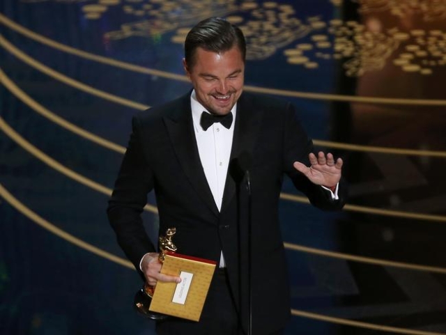 Leonardo DiCaprio accepts the Oscar for Best Actor for the movie "The Revenant" at the 88th Academy Awards in Hollywood, California February 28, 2016.  REUTERS/Mario Anzuoni