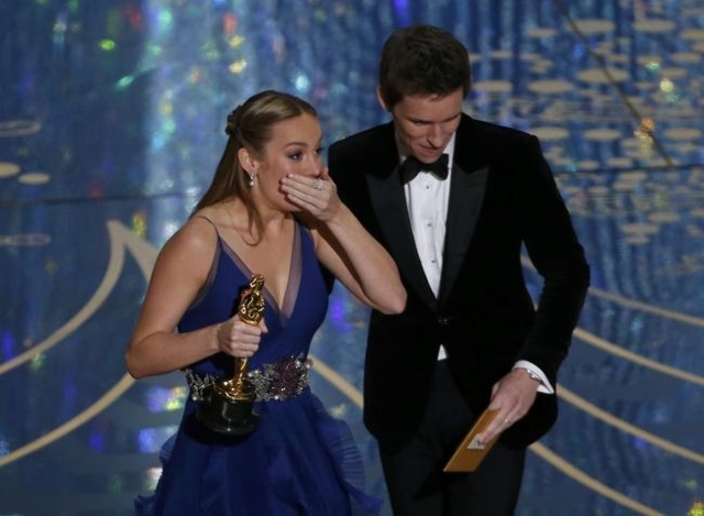 Brie Larson reacts as she takes the stage to accepts the Oscar for Best Actress for her role in "Room" from presenter Eddie Redmayne at the 88th Academy Awards in Hollywood, California F ...