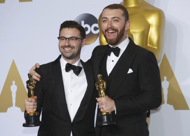 Jimmy Napes and Sam Smith (R), winners for Best Original Song for "Writing‘s on the Wall" from the film "Spectre", pose with their Oscars backstage during the 88th Academ ...