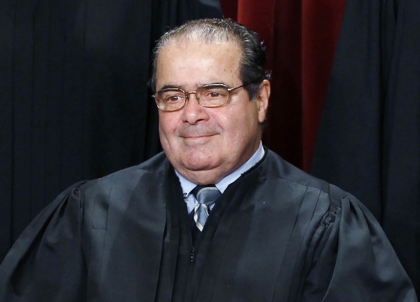 U.S. Supreme Court Justice Antonin Scalia is seen during a group portrait in the East Conference Room at the Supreme Court Building in Washington, in this file photo taken October 8, 2010. Scalia, ...