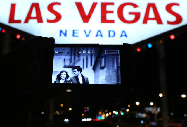 The logo of car-sharing service app Uber is seen on a smartphone at the Welcome to Fabulous Las Vegas sign Wednesday, May 6, 2015. (Bizuayehu Tesfaye/Las Vegas Review-Journal) Follow Bizu Tesfaye ...