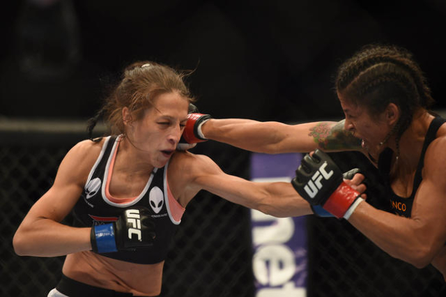 July 26, 2014; San Jose, CA, USA; Juliana Lima (red gloves) fights Joanna Jedrzejczyk (blue gloves) during the womens strawweight bout of the FOX UFC Saturday at SAP Center. (Kyle Terada/USA Today ...