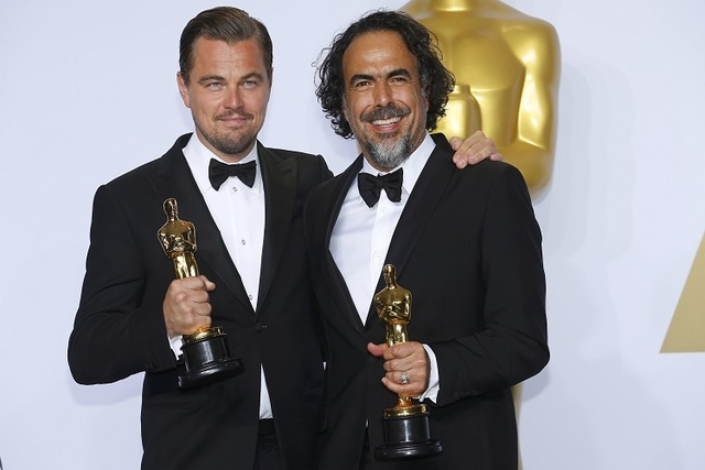 Leonardo DiCaprio (L), Best Actor winner for his role in "The Revenant," and Best Director winner Alejandro G. Inarritu, also for "The Revenant," pose with their Oscars together backstage at the 8 ...