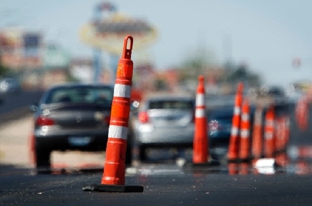 Cars as they drive through road construction (Review-Journal file)