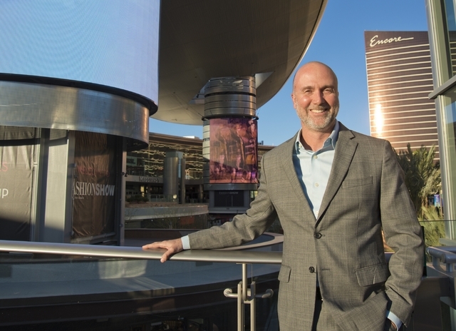 Fashion Show Mall General Manager Jim Heilmann poses for a portrait in front of the massive screens recently added to the pillars underneath the &quot;Cloud,&quot; a steel canopy at the Fa ...