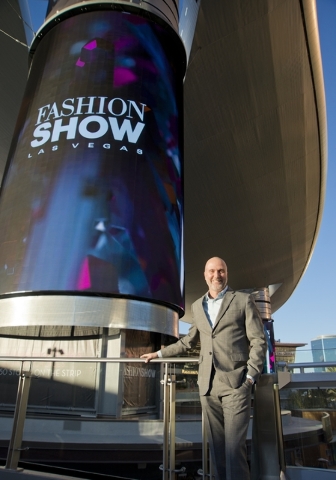 Fashion Show Mall General Manager Jim Heilmann poses for a photograph near one of the massive screens recently added to the pillars underneath the steel canopy in front of the mall on the Las Vega ...