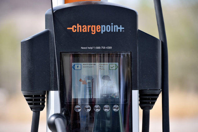 An electric vehicle charger is seen during the dedication of the first electric car charging station along U.S. Highway 95 on Tuesday, March 1, 2016, in Beatty. The station is the fist of many pla ...