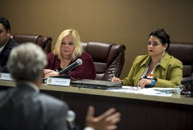 Christine Guerci-Nyhus, left, deputy attorney general, and Ileana Drobkin, chairman of the Nevada Taxicab Authority, listen during the public comment section of the Nevada Taxicab Authority meetin ...