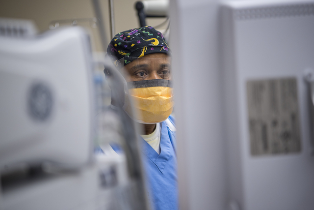 Samson Otuwa, physician anesthesiologist, monitors a patient's vitals as he preps him for surgery at University Medical Center in Las Vegas on Friday, Feb. 12, 2016. Joshua Dahl/Las Vegas Review-J ...