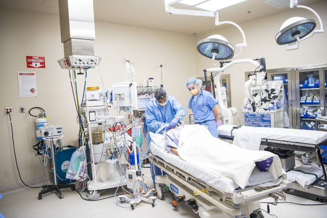 Samson Otuwa, physician anesthesiologist, left, preps a patient for surgery at University Medical Center in Las Vegas on Friday, Feb. 12, 2016. Joshua Dahl/Las Vegas Review-Journal