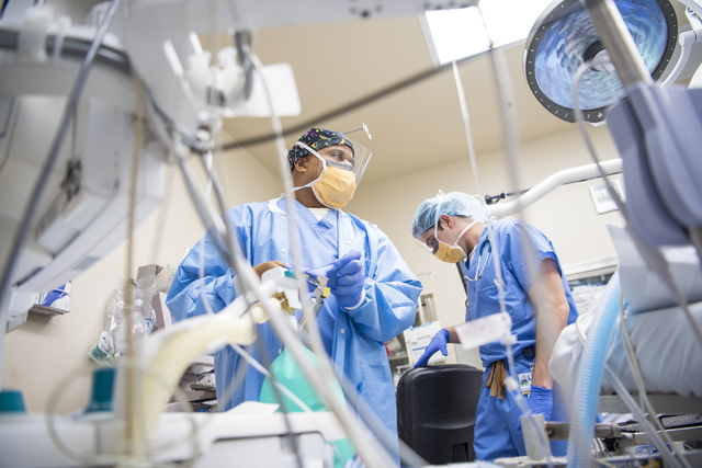Samson Otuwa, physician anesthesiologist, center, preps a patient for surgery at University Medical Center in Las Vegas on Friday, Feb. 12, 2016. Joshua Dahl/Las Vegas Review-Journal