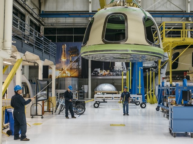 Blue Origin team members ready the New Shepard Crew Capsule during assembly in Kent, Washington in this Blue Origin handout photo released March 8, 2016. REUTERS/Blue Origin/Handout via Reuters