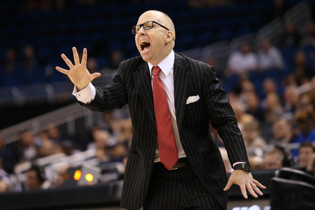 Cincinnati Bearcats head coach Mick Cronin yells from the bench in the second overtime against the Connecticut Huskies during the AAC Tournament on Friday at the Amway Center in Orlando. The Conne ...