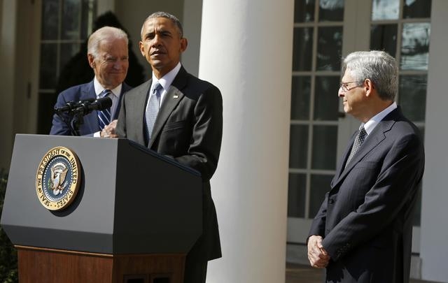President Barack Obama, left, announces Judge Merrick Garland, right, as his nominee to the U.S. Supreme Court, as Vice-President Joe Biden accompanies them in the Rose Garden of the White House i ...