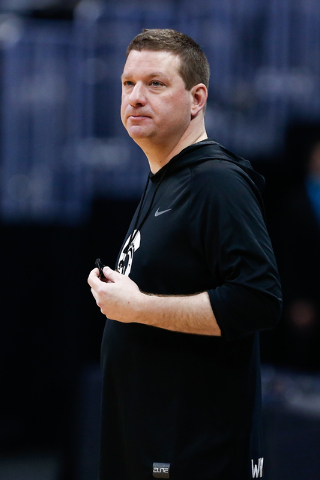 Mar 16, 2016; Denver, CO, USA; Little Rock Trojans head coach Chris Beard looks on during a practice day before the first round of the NCAA men's college basketball tournament at Pepsi Center. (Is ...