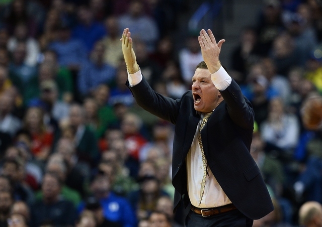 Mar 17, 2016; Denver , CO, USA; Arkansas Little Rock Trojans head coach Chris Beard yells to his players in the second half of Purdue vs Arkansas Little Rock in the first round of the 2016 NCAA To ...