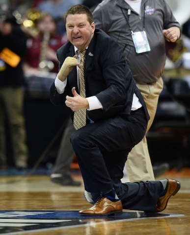 Mar 17, 2016; Denver , CO, USA; Arkansas Little Rock Trojans head coach Chris Beard celebrates his teams win over Purdue during Purdue vs Arkansas Little Rock in the first round of the 2016 NCAA T ...