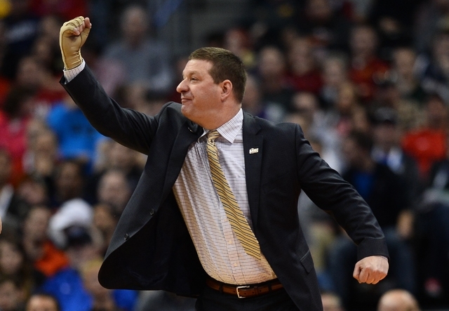 Mar 19, 2016; Denver , CO, USA; Arkansas Little Rock Trojans head coach Chris Beard gestures from court side in first half action of Iowa State vs Arkansas Little Rock during the second round of t ...