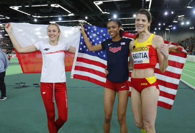 Bronze medal winner Kamila Licwinko of Poland, gold medal winner Vashti Cunningham of the U.S. and silver medalist Ruth Beitia (R) celebrate after the women's high jump during the IAAF World Indoo ...