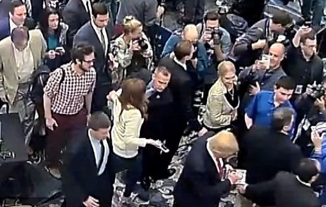 Republican Presidential candidate Donald Trump's campaign manager Corey Lewandowski (C) is seen allegedly grabbing the arm of reporter Michelle Fields in this still frame from video taken March 8, ...