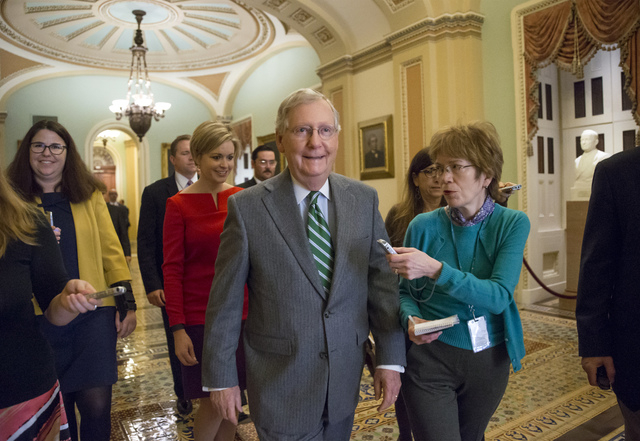 Senate Majority Leader Mitch McConnell, R-Ky., walks to the chamber after President Barack Obama urged Senate Republicans to grant hearings and a confirmation vote to Merrick Garland, his nominee  ...