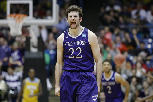 Holy Cross' Robert Champion reacts after hitting a 3-pointer during the second half against Southern University in a First Four game of the NCAA college basketball tournament, Wednesday, March 16, ...