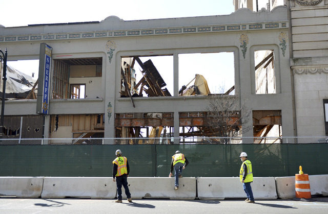 A building at 1170 Main Street in Springfield, Mass., undergoes demolition to make way for the MGM casino project, March 9, 2016. The casino is expected to open in September 2018, a year behind in ...