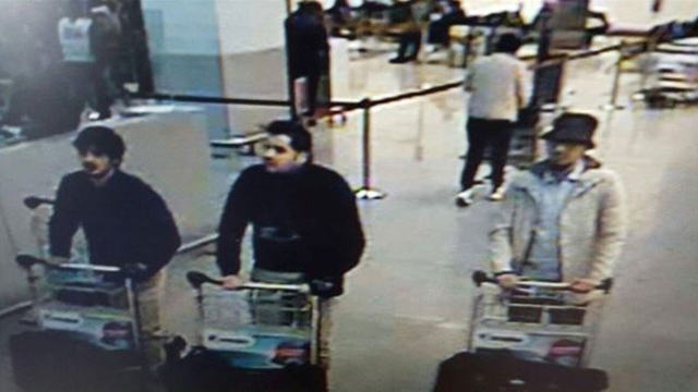 In this image provided by the Belgian Federal Police in Brussels on Tuesday, March 22, 2016 of three men who are suspected of taking part in the attacks at Belgium's Zaventem Airport. The man at r ...