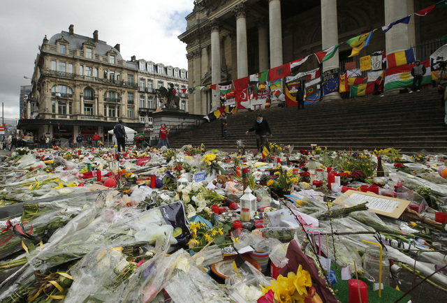 A general view of the tributes left for the victims of the recent bomb attacks in Brussels in the Place de la Bourse in Brussels, Monday, March, 28, 2016. The Belgian health minister says four of  ...