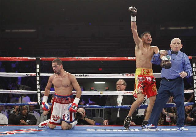 Las Vegan Jessie Vargas, right, celebrates after defeating Sadam Ali in the ninth round to win the World Boxing Organization welterweight championship Saturday in Washington, D.C. PHOTO BY TOM HOG ...