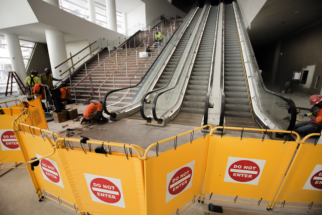 Men work on the stairwell at the T-Mobile Arena behind New York-New York on Monday, Feb. 29, 2016. The joint venture partners AEG and MGM Resorts is scheduled to open the arena next month. Jeff Sc ...