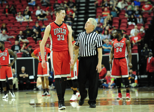 UNLV forward Stephen Zimmerman Jr. (33) talks with referee Eric Cury after he was assessed a technical foul against Fresno State in the first half of their Mountain West Conference semifinal baske ...