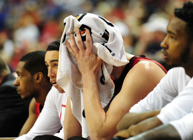 UNLV forward Stephen Zimmerman Jr. (33) wipes sweat from his face after he fouled out against Fresno State in the second half of their Mountain West Conference semifinal basketball game at the Tho ...