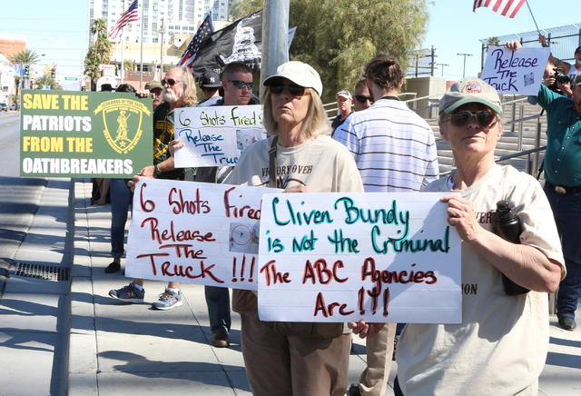 Terry Noonkester, right, and Jane Doherty, second right, protest outside Lloyd George Federal Building on Thursday, March 10, 2016, in Las Vegas. Cliven Bundy appears in court this afternoon. Bizu ...