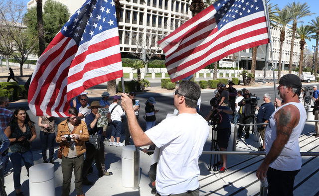 Greg Whaler, left, and Rick Pollard, both of Las Vegas, protest outside the Lloyd George Federal Building on Thursday, March 10, 2016, in Las Vegas. Cliven Bundy appears in court this afternoon. B ...