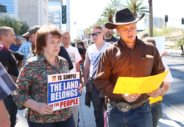 Carol Bundy, wife of Cliven Bundy, and her son Arden protest outside Lloyd George Federal Building on Thursday, March 10, 2016, in Las Vegas. Cliven Bundy appears in court this afternoon. Bizuayeh ...