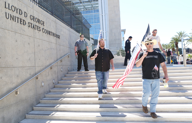 People protest outside Lloyd George Federal Building on Thursday, March 10, 2016, in Las Vegas. Cliven Bundy appears in court this afternoon. Bizuayehu Tesfaye/Las Vegas Review-Journal Follow @biz ...