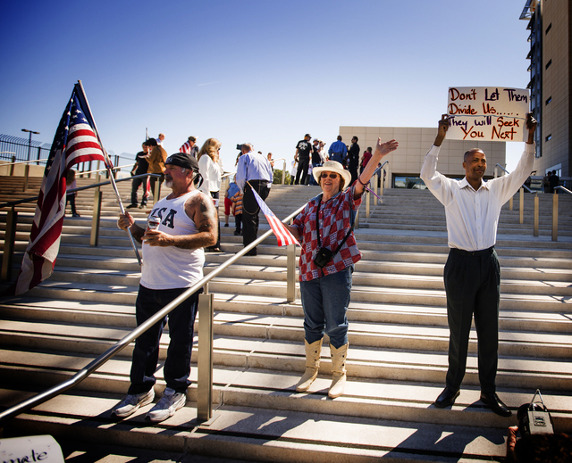 Rick Pollard,left, Cathryn Adams and Calvin Leslie demonstrate in front of Lloyd George United States Courthouse on Thursday, March 10, 2016. Jeff Scheid/Las Vegas Review-Journal Follow @jlscheid