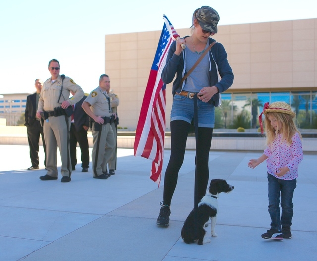 Leslie Enright and her daughter, Maryanne, 4, and dog Mia from California demonstrate in front of the Lloyd George Federal Building on March 10, 2016, in Las Vegas. (Jeff Scheid/Las Vegas Review-J ...