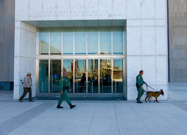 Metro K-9 unit patrols around the Lloyd George Federal Building on Thursday morning, March 10, 2016, in Las Vegas, before demonstrators started gathering. (Jeff Scheid/Las Vegas Review-Journal)