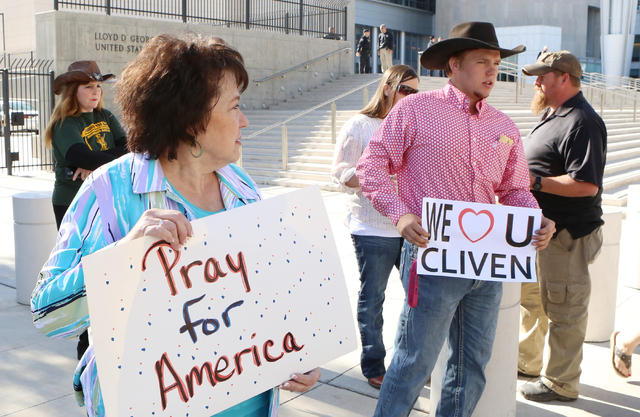 Carol Bundy, wife of Nevada rancher Cliven Bundy, left, and her son Arden, protest outside Lloyd George Federal Building on Thursday, March 17, 2016, in Las Vegas. Bizuayehu Tesfaye/Las Vegas Revi ...