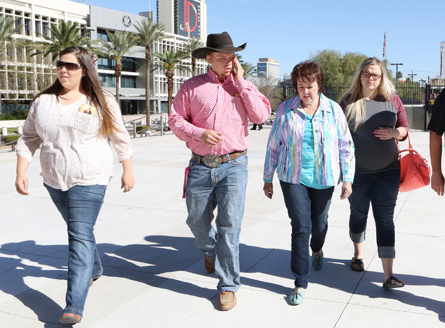Carol Bundy, wife of Nevada rancher Cliven Bundy, second right, and her children Bailey Logue, left, Arden Bundy, second left, and Stetsy Cox, right, arrive at Lloyd George Federal Building on Thu ...