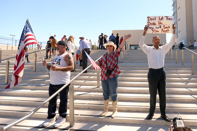 Rick Pollard, left, Cathryn Adams and Calvin Leslie demonstrate in front of Lloyd George Federal Building on March 10, 2016 in Las Vegas. (Jeff Scheid/Las Vegas Review-Journal)