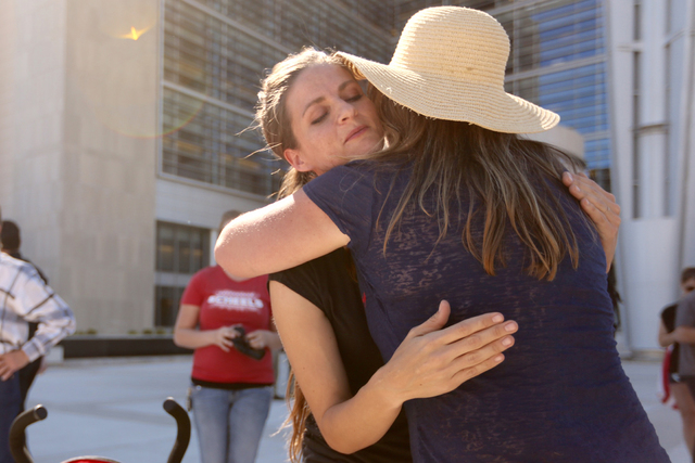 Thara Tenney, left, daughter of Robert La Voy Finicum, gets a hug from Dee (didn't give her last name) in front of the Lloyd George Federal Building on March 10, 2016, in Las Vegas. (Jeff Scheid/L ...