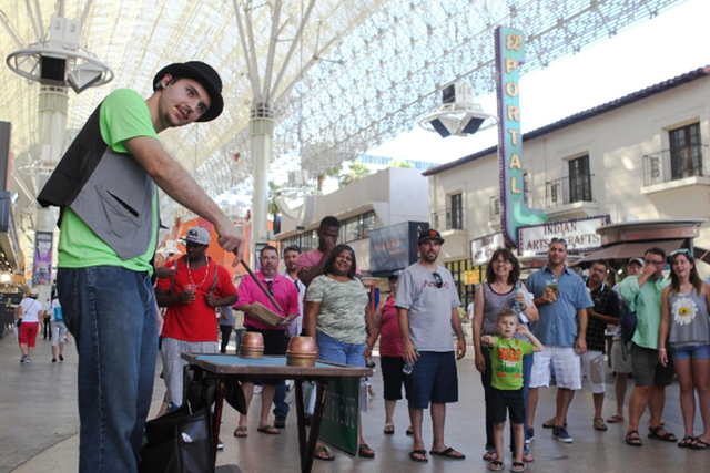 James Kelsey performs magic tricks on Fremont Street on Tuesday, July 28 2015. (James Tensuan/Las Vegas Review-Journal) Follow James Tensuan on Twitter @jtensuan