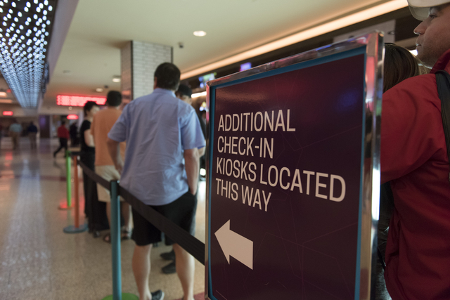 Signage for the new self check-in kiosks stands adjacent to the traditional check-in counter located in the lobby at The Linq Hotel in Las Vegas Wednesday, March 16, 2016. Jason Ogulnik/Las Vegas  ...