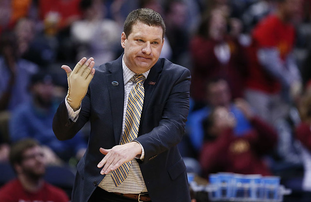 Arkansas Little Rock coach Chris Beard signals for a timeout in first half action of Iowa State vs Arkansas Little Rock during the second round of the 2016 NCAA Tournament at Pepsi Center in Denve ...