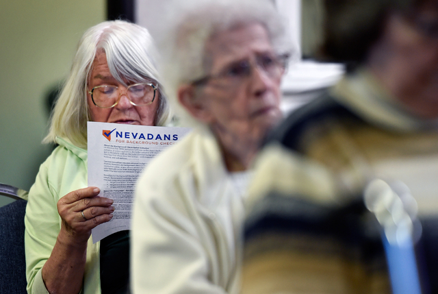 Sylvia Hackethorn reads during a meeting on a proposed gun background check initiative at the Journey United Methodist Church Monday, March 14, 2016, in Las Vegas. David Becker/Las Vegas Review-Jo ...