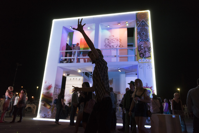 Odin Starr dances during the illumination ceremony for the Life Cube in the Llama Lot at Fremont Street and 9th Street in Las Vegas Saturday, March 19, 2016. The ceremony kicks off two weeks of cu ...