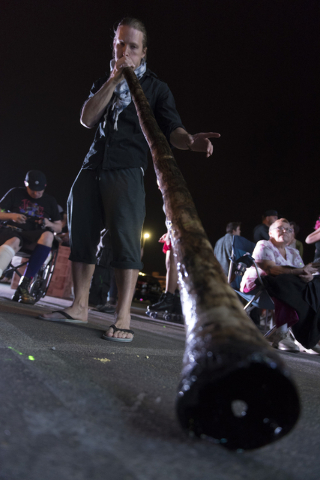 Farren Tayler plays a didgeridoo during the illumination ceremony for the Life Cube in the Llama Lot at Fremont Street and 9th Street in Las Vegas Saturday, March 19, 2016. The ceremony kicks off  ...